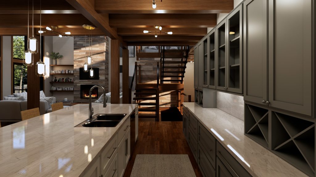 Modern mountain home kitchen with a large light stone island and double sink, dark gray cabinetry, warm wood ceiling beams and floors, pendant lighting, and an open staircase leading to the loft; the living room and stone fireplace are visible beyond.