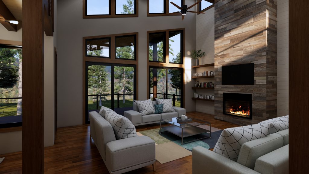 Modern living room with three light-colored sofas, a stone fireplace and TV, built-in bookshelves, wood floors, and large windows overlooking pine trees.