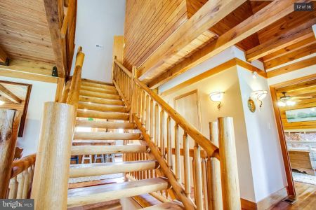 Hampton Log Home Floor Plan with Half Log Custom Stairs