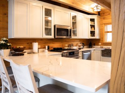 A picture of a kitchen with the countertop in the foreground